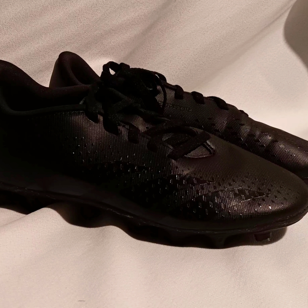 Black Adidas Predator Kids soccer cleets.